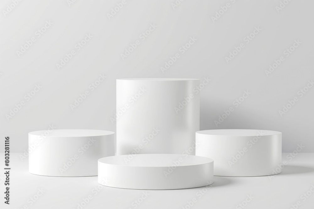 A group of white pedestals on a white surface. Ideal for showcasing products or artwork A group of white pedestals on a white surface. Ideal for showcasing products or artwork