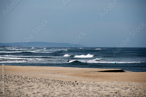 People surfing the sea waves in Aveiro portugal sand dunes Atlantic Ocean beach view landscape panorama