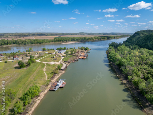 Gasconade River at confluence with the Missouri River, springtime aerial view with an old boatyard and barges photo