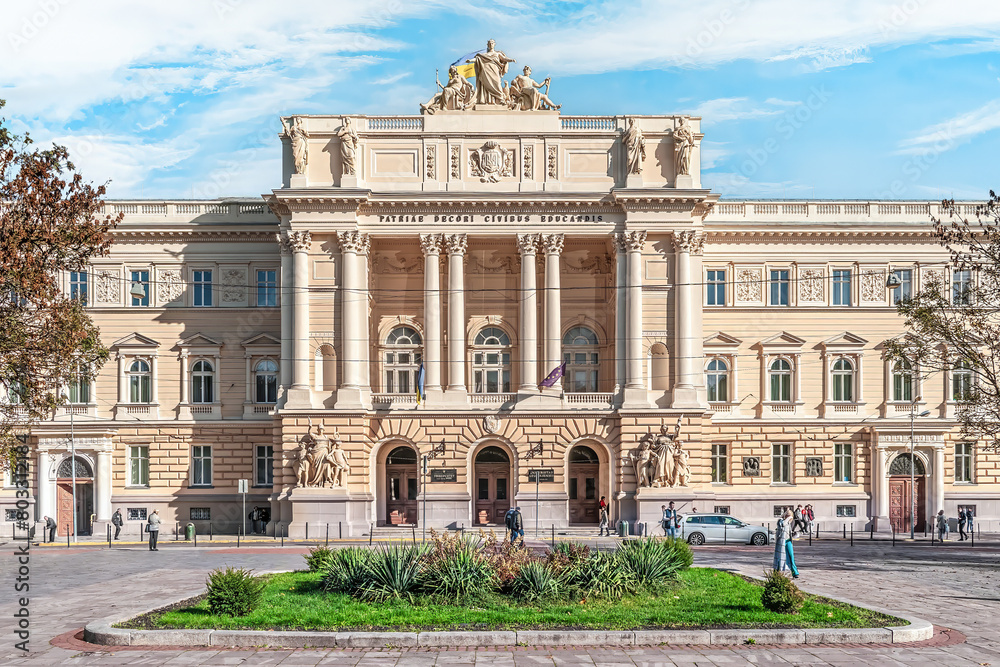 Lviv, Ukraine - November 2, 2023: Flowerbed on the square in front of The main building of Ivan Franko National University of Lviv. The former House of the Galician Diet by Juliusz Hochberger, 1881