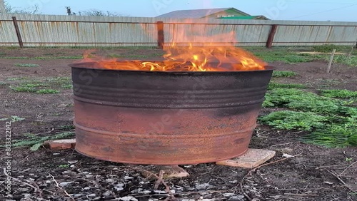 burning garbage in a barrel photo