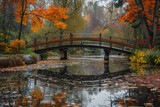 A tranquil pond surrounded by colorful autumn foliage, with a wooden bridge spanning the water.