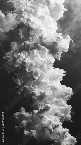 White smoke rising against black background