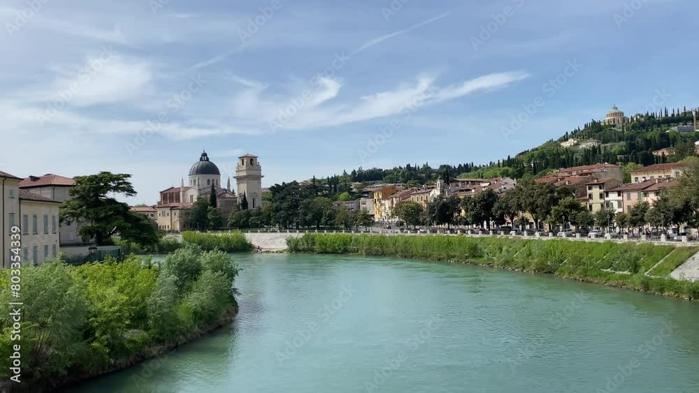 Horizontal video of the Adige river that crosses Verona, cityscape amazing view with blue transparent waterfront from the stone bridge. Travelling, tourism and vacation in Italy, Veneto region. Horizontal video of the Adige river that crosses Verona, cityscape amazing view with blue transparent waterfront from the stone bridge. Travelling, tourism and vacation in Italy, Veneto region.