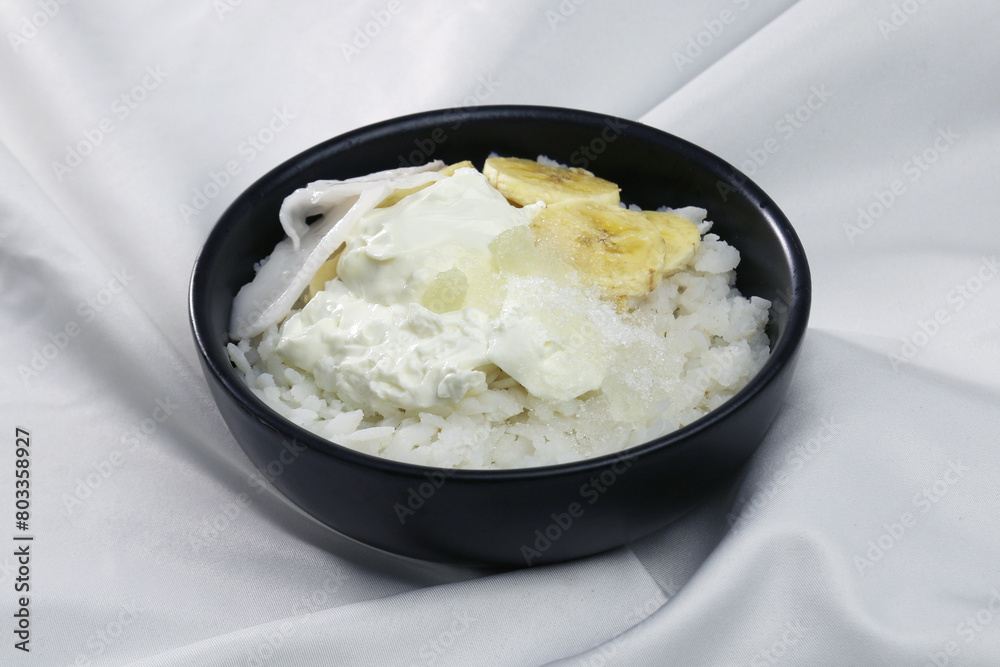 Doi Chira, traditional Bengali healthy and cool summer food. Main ingredient are water soaked flatten rice and curd. Others are Sugar, Salt, Banana slices, Coconut etc. Doi Chira, traditional Bengali healthy and cool summer food. Main ingredient are water soaked flatten rice and curd. Others are Sugar, Salt, Banana slices, Coconut etc.