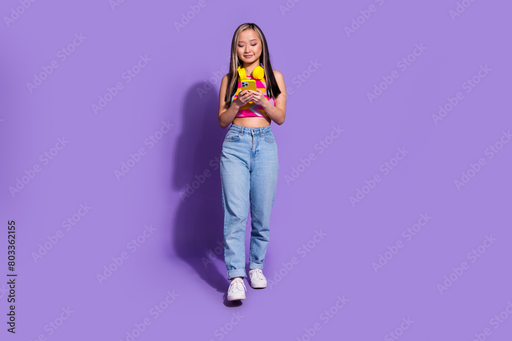 Photo of lovely cute girl wear trendy clothes going walking chatting isolated on purple color background