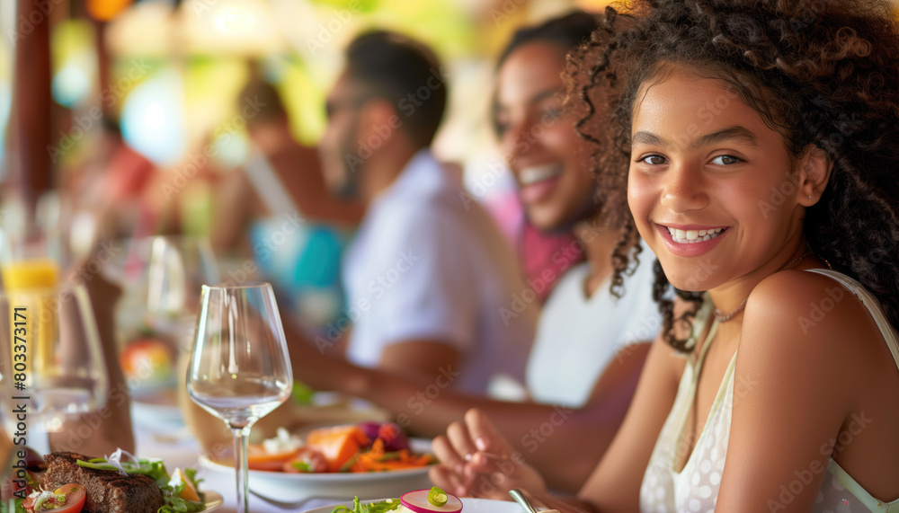 Close-up of family on holiday or vacation eating near a beach a la carte with the blue sea in the background Close-up of family on holiday or vacation eating near a beach a la carte with the blue sea in the background