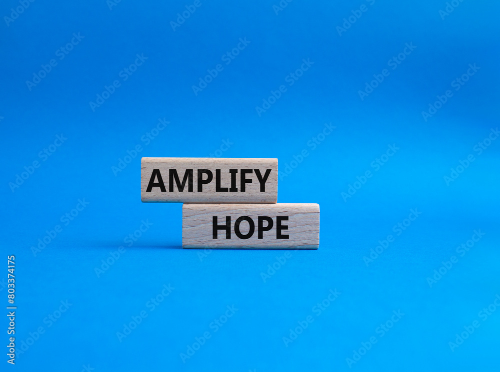Amplify Hope symbol. Wooden blocks with words Amplify Hope. Beautiful blue background. Business and Amplify Hope concept. Copy space. Amplify Hope symbol. Wooden blocks with words Amplify Hope. Beautiful blue background. Business and Amplify Hope concept. Copy space.