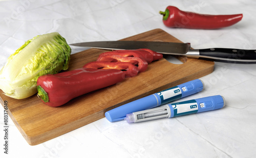 Original Danish Ozempic Insulin injection pen for diabetics and vegetables. photo