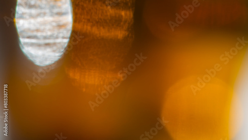 Abstract blurred background, bokeh spots on orange and brown.