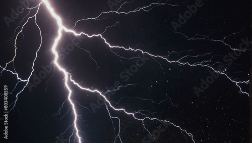 A burst of lightning against a pitch-black canvas, illuminating the night sky.