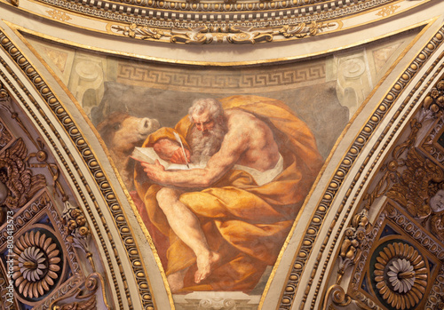MILAN, ITALY - MARCH 5, 2024: The baroque fresco of St. John the Evangelist from cupola of church Chiesa di San Vittore al Corpo by Daniele Crespi (1598 – 1630). photo