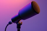 A shotgun microphone, its long, slender design focused and ready, set against a solid, dusk purple background.