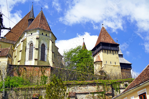 Exterior view of the old Gothic church and the fortification next to it - The Biertan fortified church in Sibiu County, in the Transylvania region of Romania.
