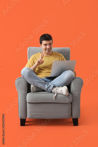 Young man with laptop video...
