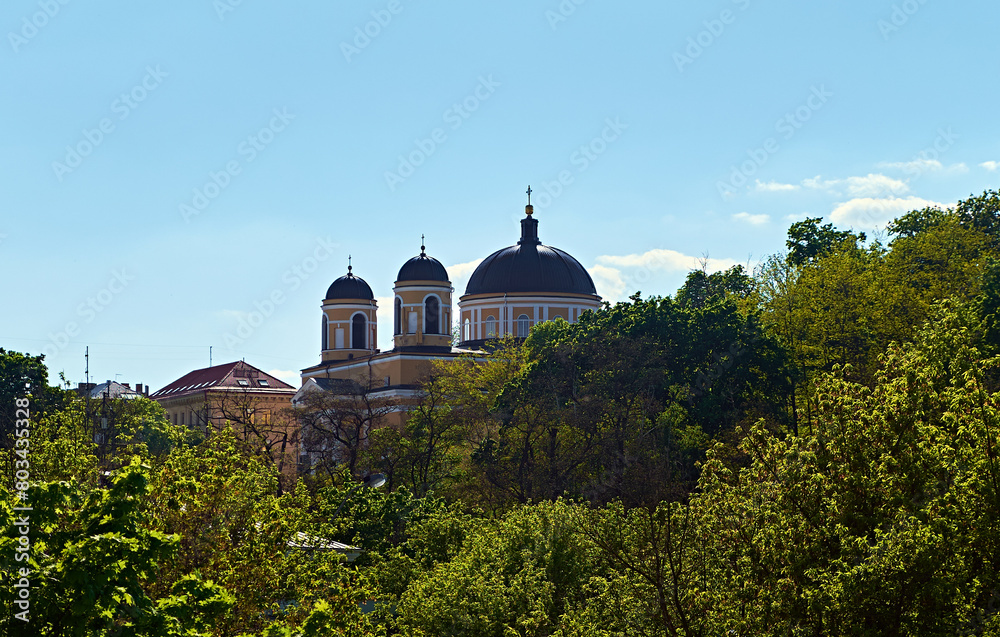Serene Roman Catholic Church of St. Alexander Parish. The church's towering spires pierce the clear blue sky.