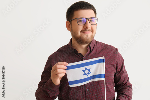 Young Jewish man with flag ...