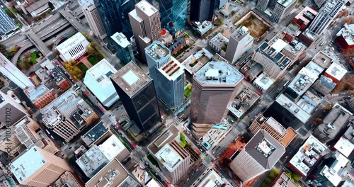 Rising high above the rooftops of the highest buildings in the panorama of Seattle, Washington, USA. Densely built scenery of metropolis at day. photo