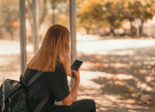 woman sitting on the bench text phone 