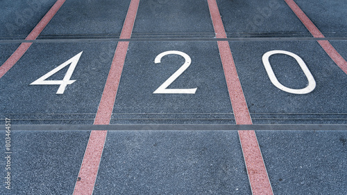 420 embedded in a terrazzo floor. 420 is culture slang for hashish or marijuana consumption. It also refers to cannabis-oriented celebrations that take place on April 20th.