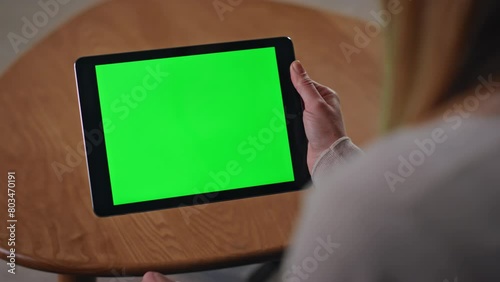 Unrecognizable woman shopping chroma key tablet sitting apartment close up. 