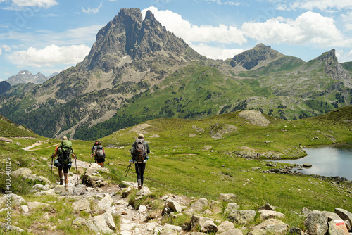 Group of experienced hikers hiking in beautiful mountains in Pyrenees (Lacs d' Ayous), popular route, France photo
