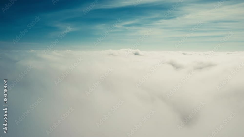 Flying down through moving clouds