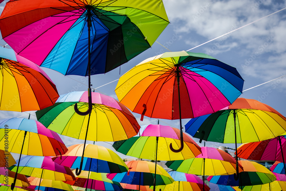 Obraz premium Many colorful umbrellas. Umbrella in the air.