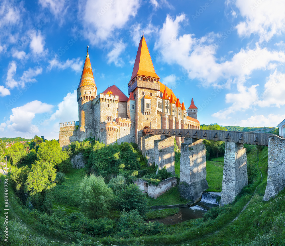 Captivating panoramic morning view of Hunyad Castle / Corvin's Castle with wooden bridge.