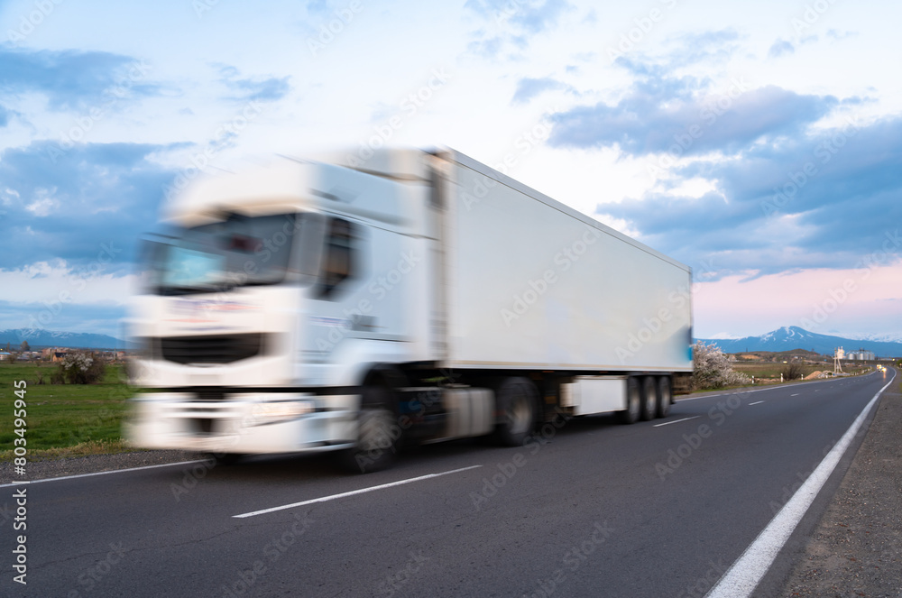 Cargo truck in motion on the road, cargo transportation concept