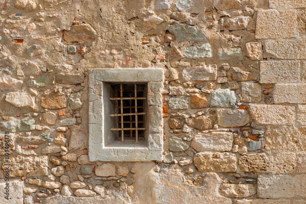 Old wall with a small window Old wall with a small window