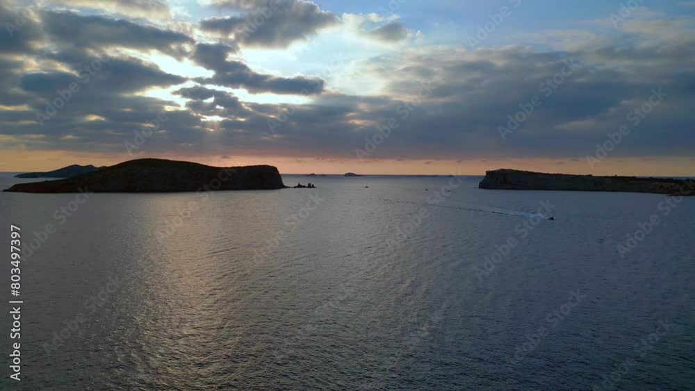 Ibiza sunset seascape with island silhouette Best aerial top view flight drone Ibiza sunset seascape with island silhouette Best aerial top view flight drone