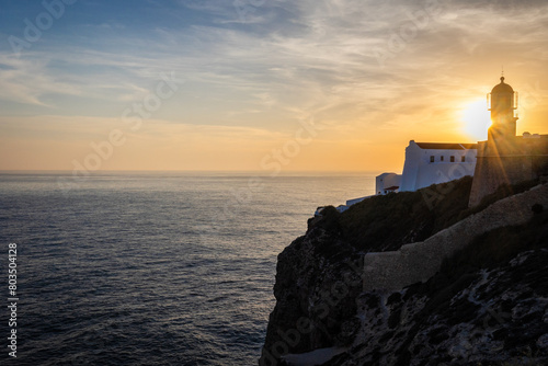 Farol do Cabo de Sao Vincente in Sagres in the Algarve Portugal. Overlooking the blue sea during a beautiful golden sunset