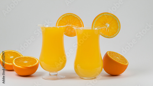 product photo of hurricane glass with orange juice on white background