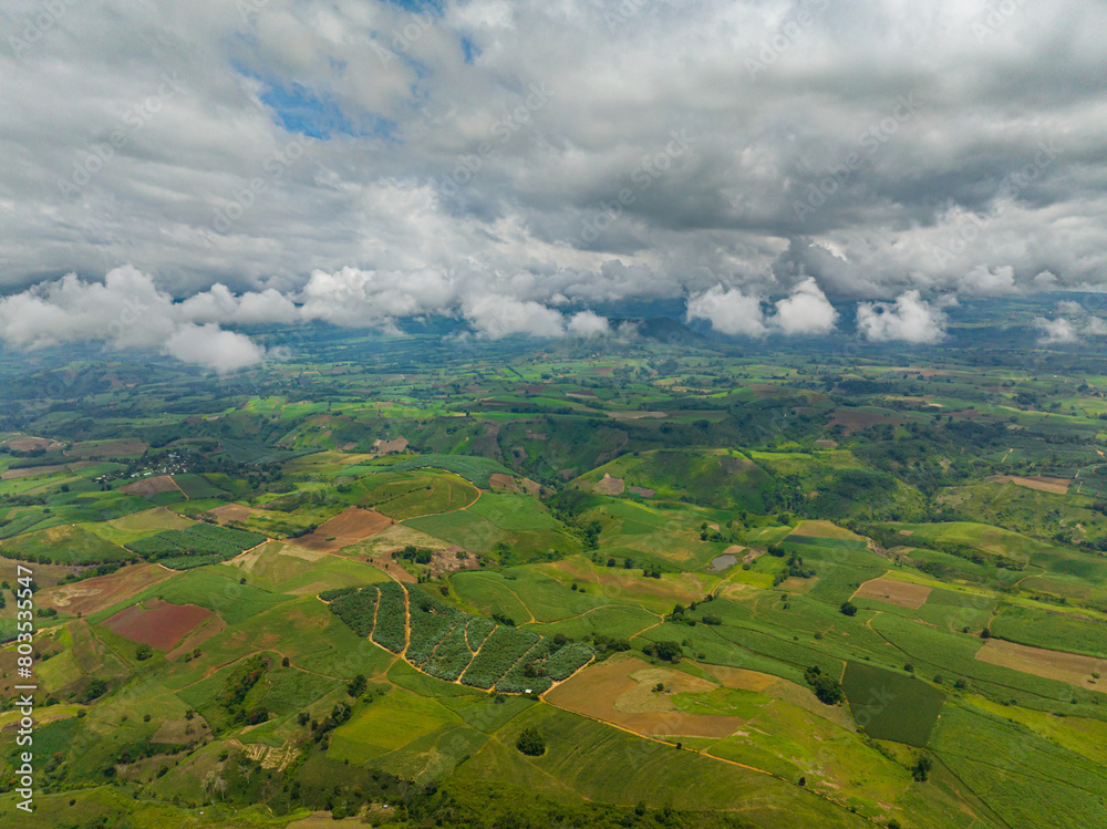Top view of Mountain slopes with forest and agricultural land of farmers. Mindanao, Philippines.