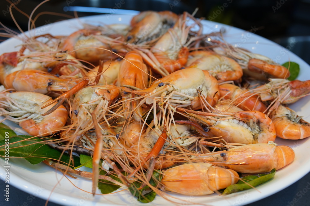 boiled shrimp Steamed shrimps with lemon and herbs. Seafood, shellfish. Shrimps prawns on plate. boiled shrimp Steamed shrimps with lemon and herbs. Seafood, shellfish. Shrimps prawns on plate.