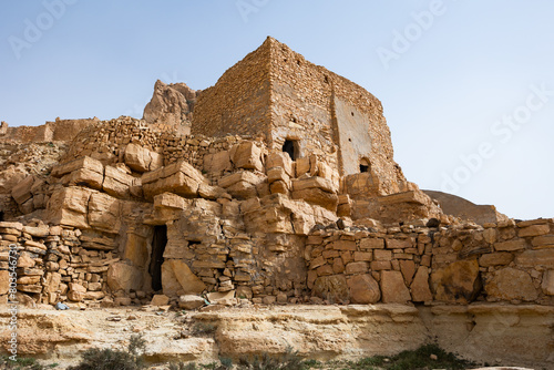 Panoramic view of ruins Berber mountain village Guermassa, Tataouine in southern Tunisia photo