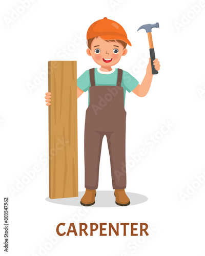 Cute little boy carpenter holding wood and hammer