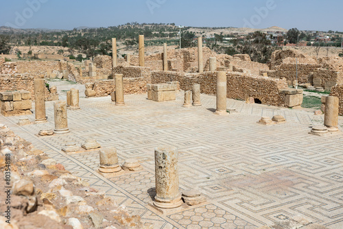 Remains of ancient Roman thermes bathing-place, built of light sandstone during Roman colonization era. Ancient city of Sufetula on African continent in modern Tunisia photo