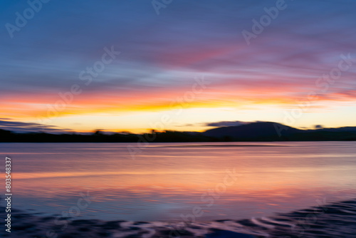 Background sunset intentional camera movement effect soft hues on morning light blue hour. © Brian Scantlebury