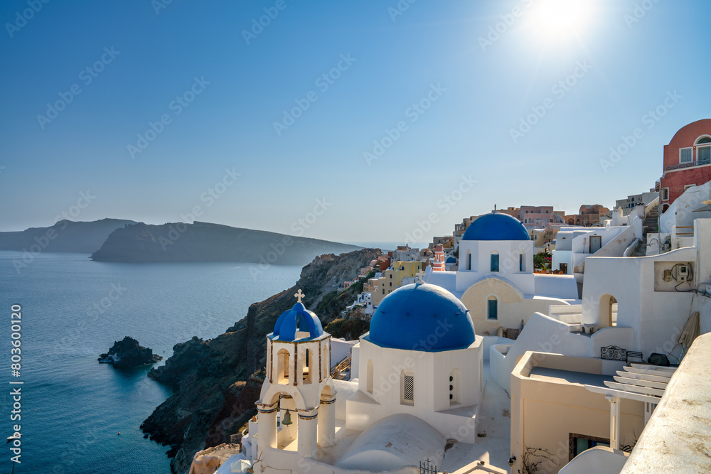 Fototapeta premium Blue domes and Oia village on Santorini island. Greece
