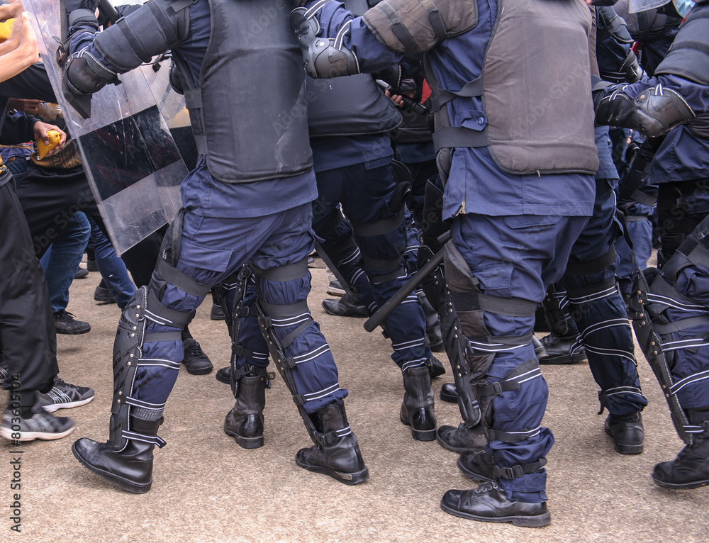 Riot police dispersed protesters and were pelted with paint.
Riot police dispersed protesters and were pelted with paint.