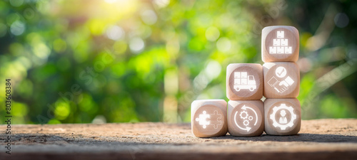 SRM, Supplier relationship management concept, Wooden block on desk with supplier relationship management icon on virtual screen. photo