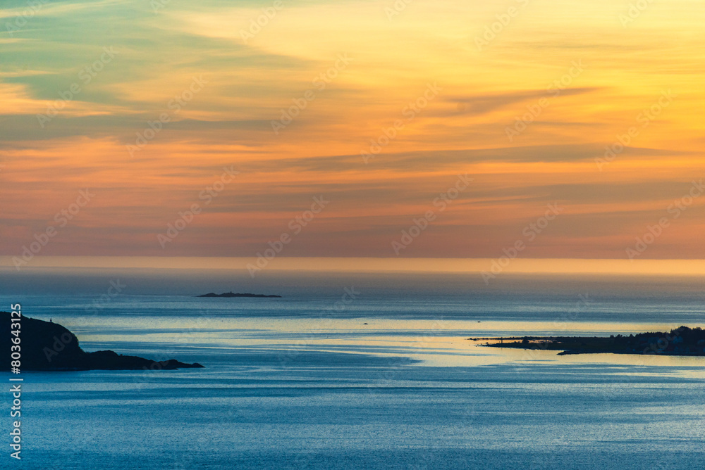 Obraz premium top view of a sunset over The city of Alesund and the sea during a sunny evening, Norway