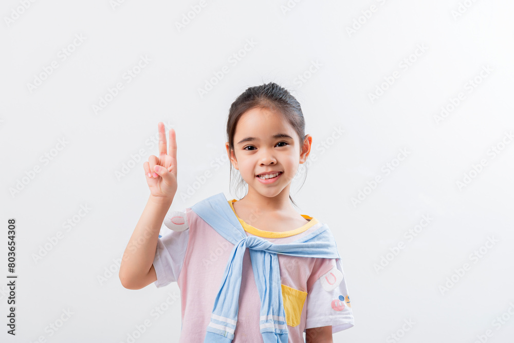 Cheerful Asian girl Posing cutely on a white background Cheerful Asian girl Posing cutely on a white background