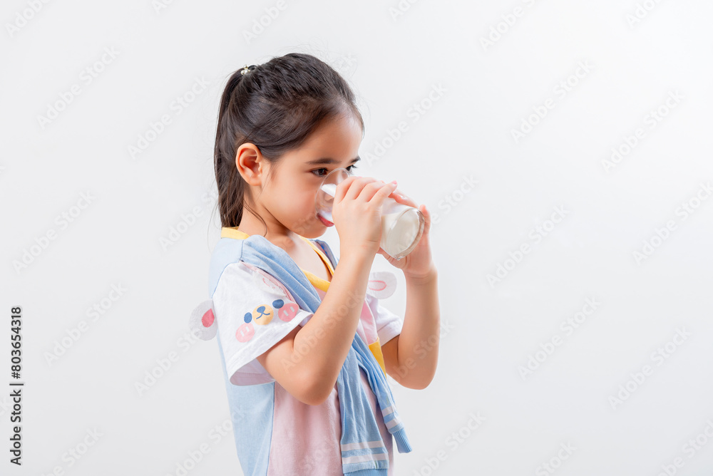Little Asian girl Image of Asian child drinking milk Little Asian girl Image of Asian child drinking milk