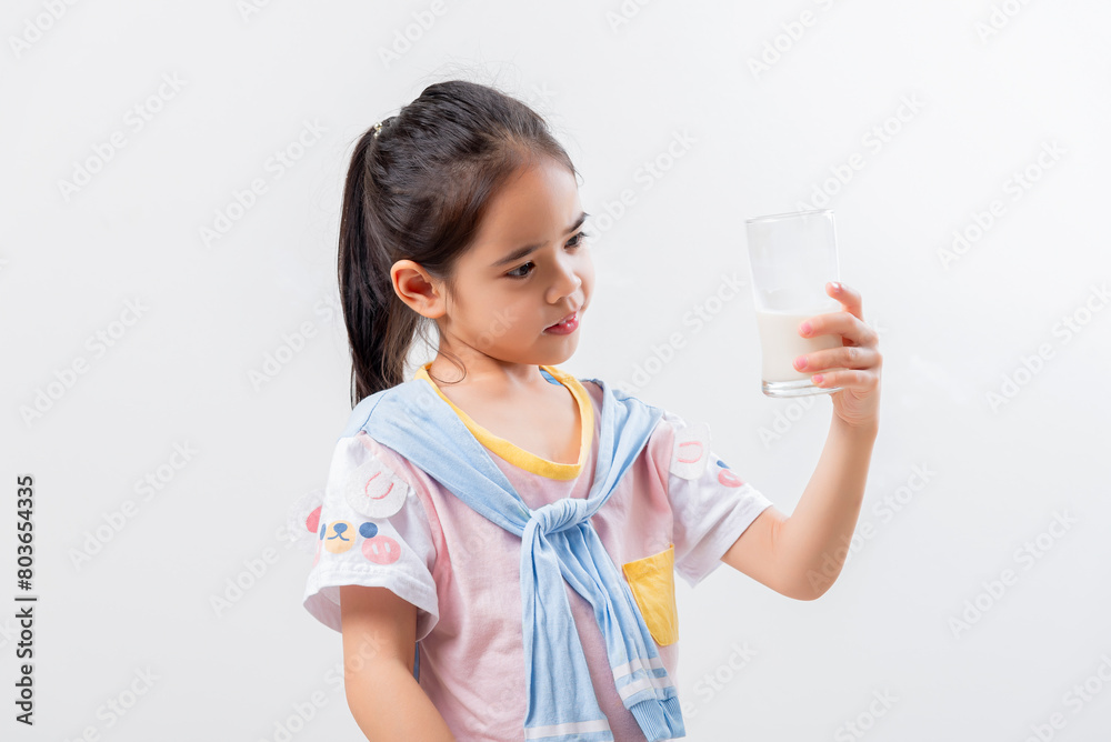 Little Asian girl Image of Asian child drinking milk Little Asian girl Image of Asian child drinking milk