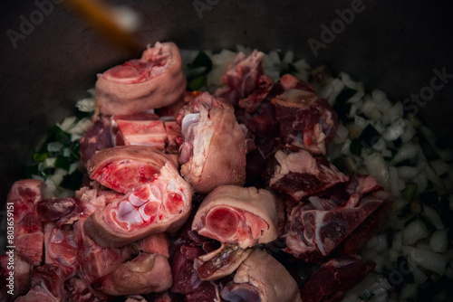 photography of locro, traditional Argentine food to celebrate national days with worker's day, May 25, July 9, with corn beans pig's feet meat pumpkin photo