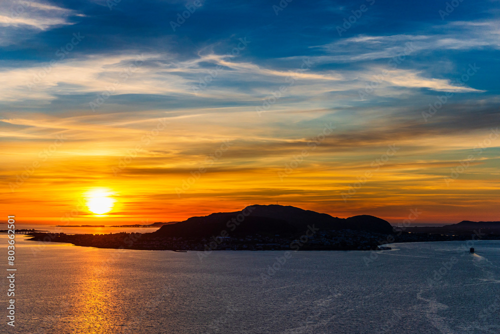  top view of a sunset over The city of Alesund and the sea during a sunny evening, Norway