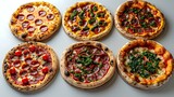 Tempting Pizza Display: An Array of Six Colorful Pizzas on a White Background